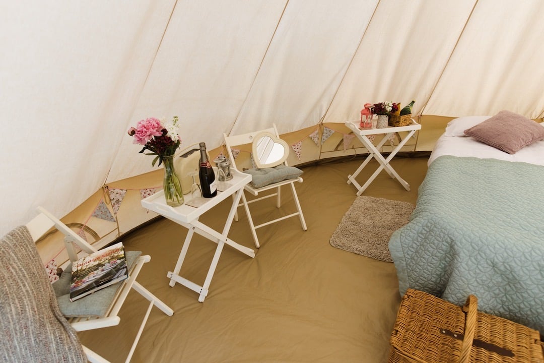 Interior of bell tent with table and chairs